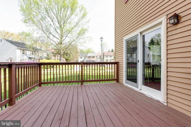 wooden deck with a residential view
