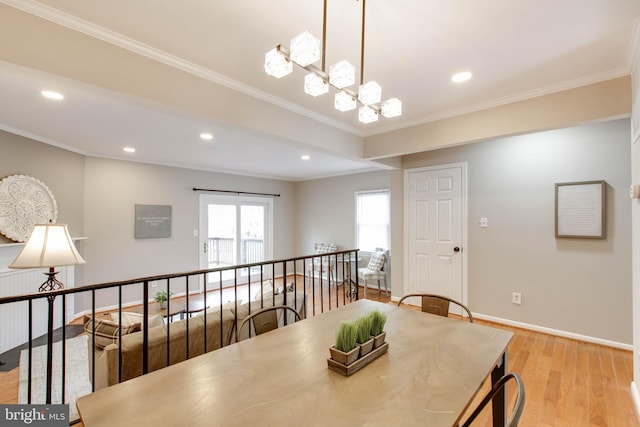 dining area with recessed lighting, crown molding, baseboards, light wood-style flooring, and a notable chandelier