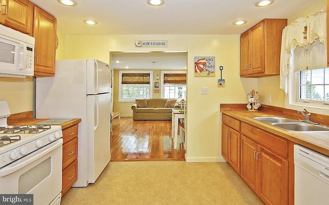 kitchen featuring sink and white appliances