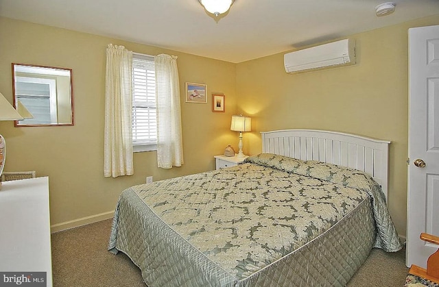 carpeted bedroom with a wall unit AC