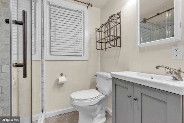 bathroom featuring tile patterned flooring, vanity, and toilet