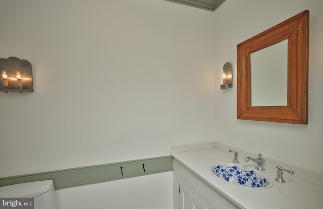 bathroom with vanity and toilet