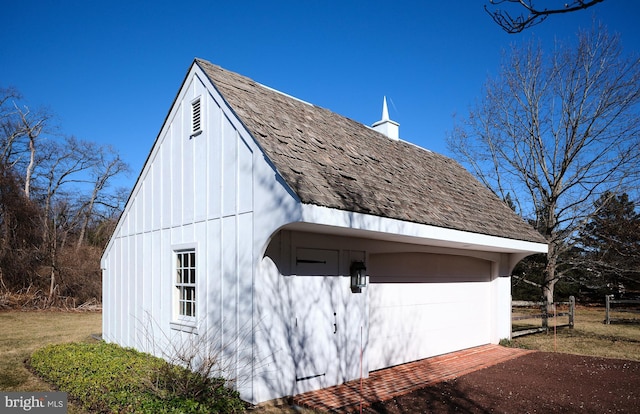 view of property exterior featuring an outbuilding and a garage