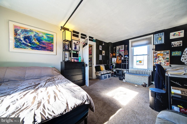 carpeted bedroom with a textured ceiling