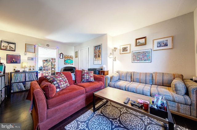 living room with dark hardwood / wood-style flooring