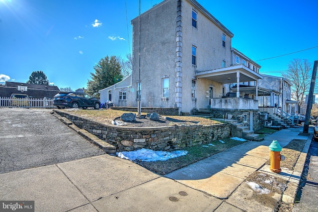 view of side of home with a porch