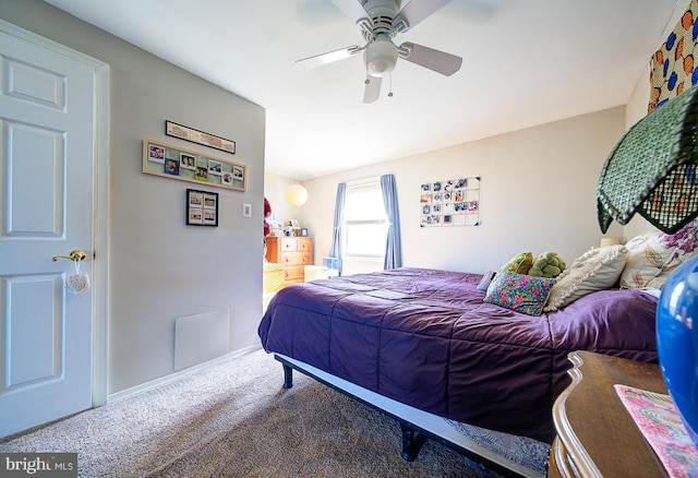 bedroom with ceiling fan and carpet floors