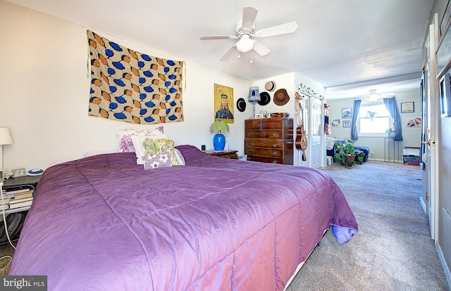 bedroom with ceiling fan and carpet floors