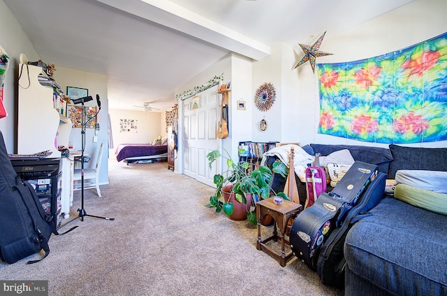 carpeted living room with ceiling fan