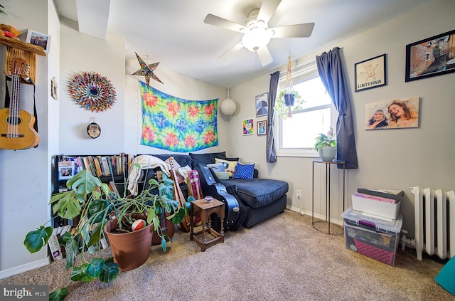 game room with radiator heating unit, light colored carpet, and ceiling fan