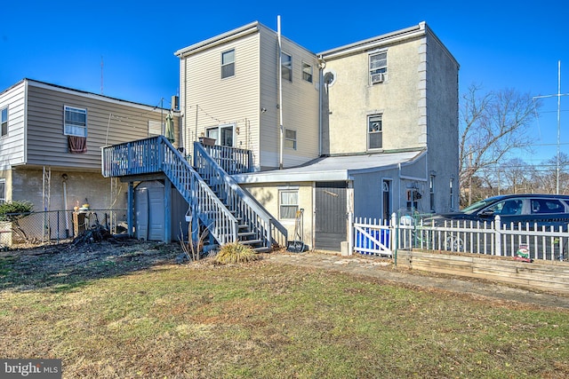 rear view of property with a lawn