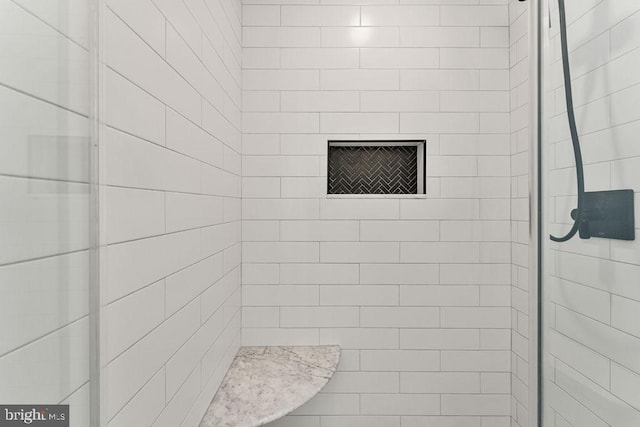 bathroom featuring a shower stall