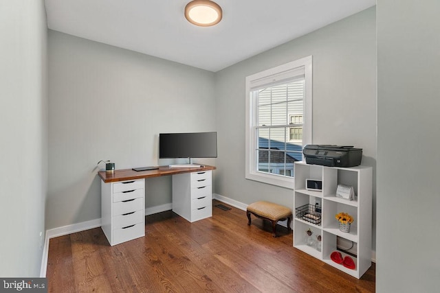 home office featuring baseboards, visible vents, and dark wood-style flooring