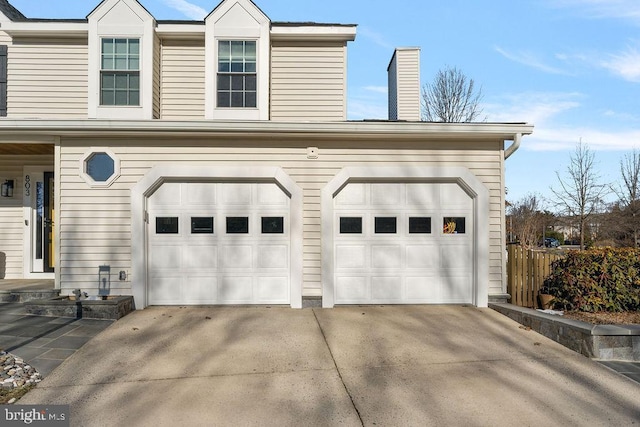 garage featuring driveway