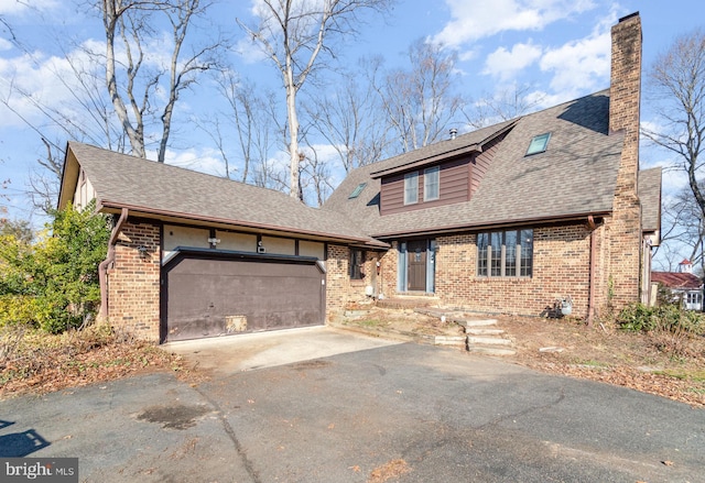 view of front of home with a garage, brick siding, driveway, and roof with shingles