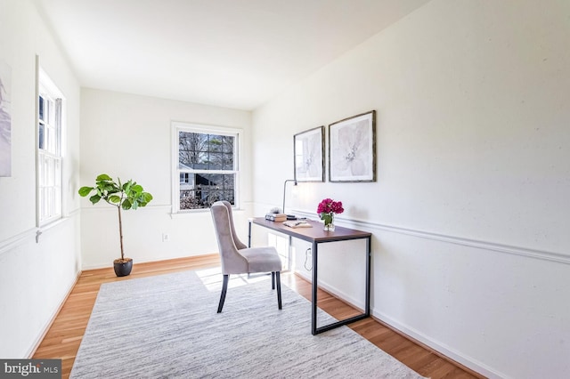 office area with light hardwood / wood-style floors