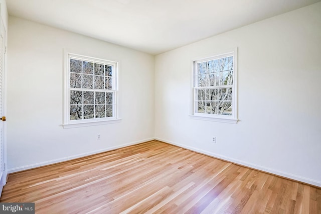 unfurnished room featuring light hardwood / wood-style flooring