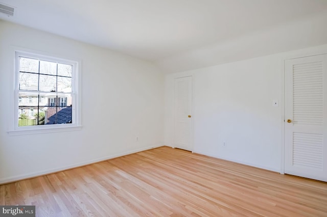 unfurnished room featuring light hardwood / wood-style flooring