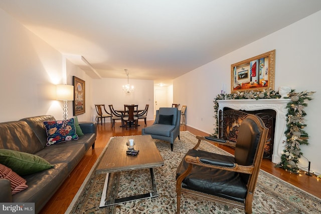 living room featuring hardwood / wood-style flooring and a chandelier