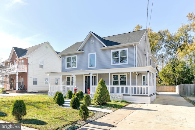 view of front of home featuring a porch and a front yard