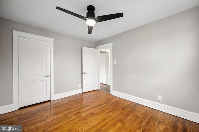 unfurnished bedroom featuring hardwood / wood-style flooring and ceiling fan