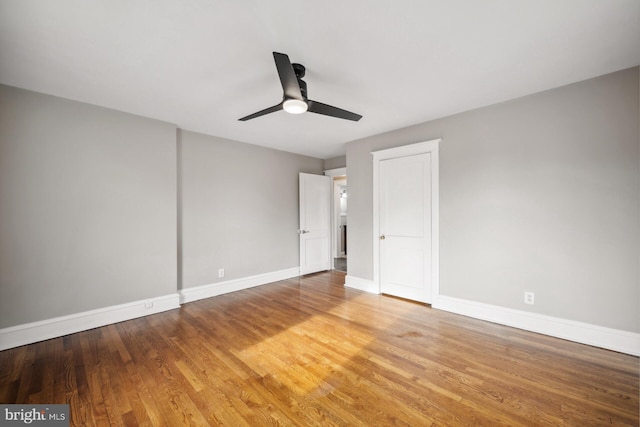 unfurnished bedroom featuring hardwood / wood-style flooring and ceiling fan