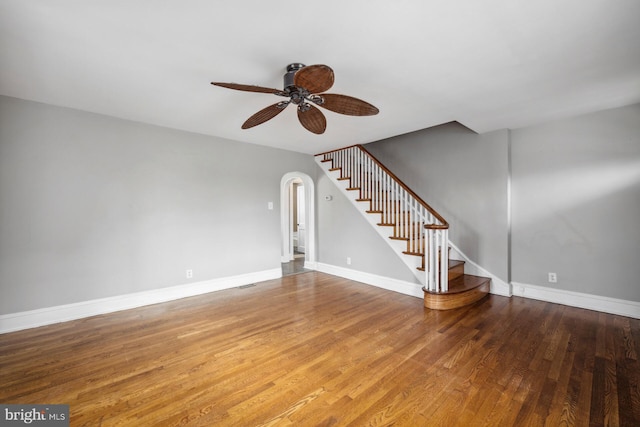 unfurnished living room featuring ceiling fan and wood-type flooring