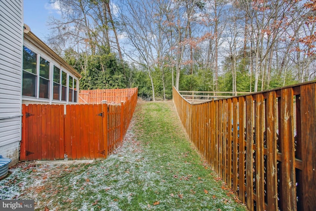 view of yard with a garden and fence