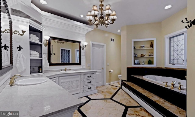 bathroom featuring built in shelves, vanity, toilet, and an inviting chandelier