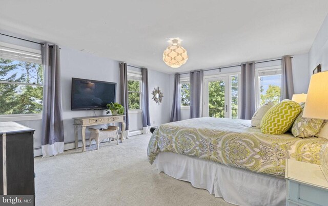 carpeted bedroom with a baseboard radiator