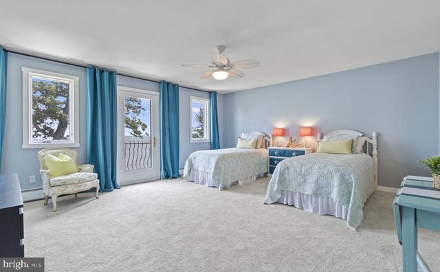 bedroom featuring a baseboard radiator, carpet floors, access to outside, and ceiling fan