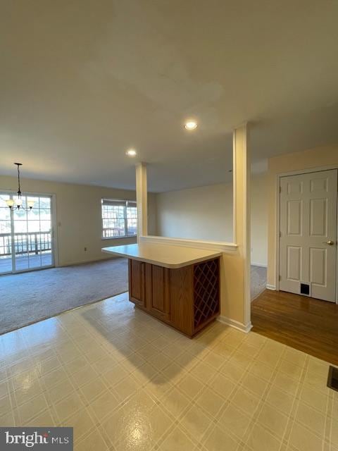 kitchen with an inviting chandelier and hanging light fixtures