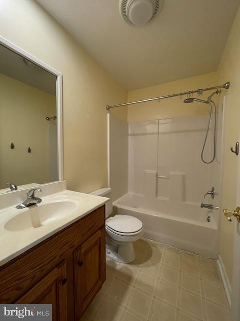 full bathroom featuring vanity, shower / tub combination, and toilet