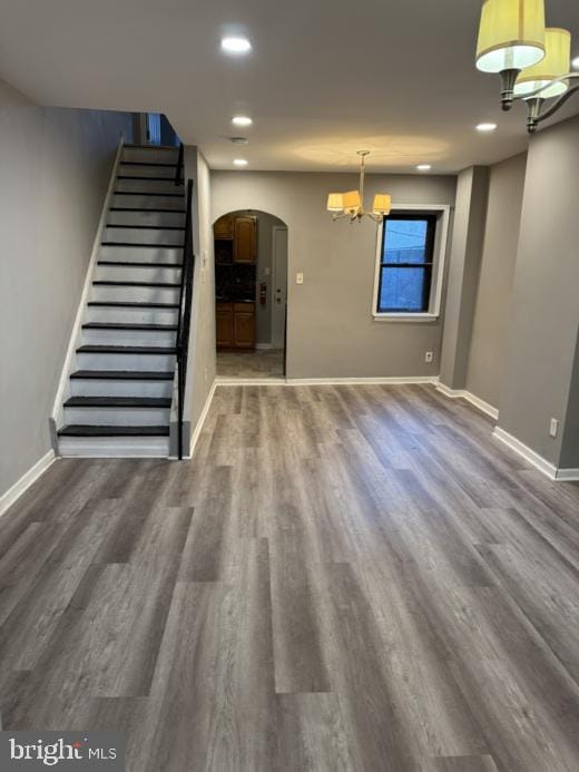 unfurnished living room featuring dark hardwood / wood-style floors