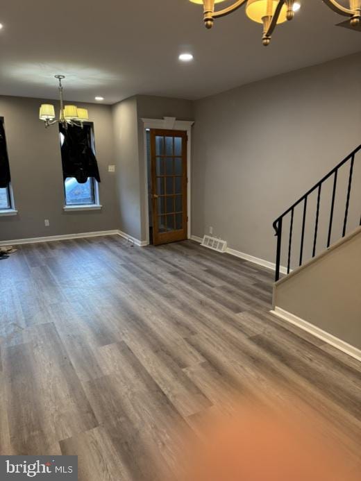 unfurnished living room with wood-type flooring