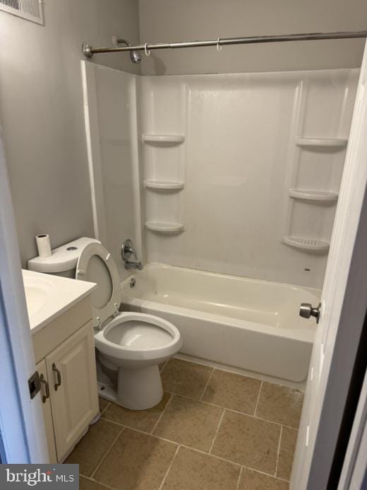 full bathroom featuring vanity, bathing tub / shower combination, and toilet