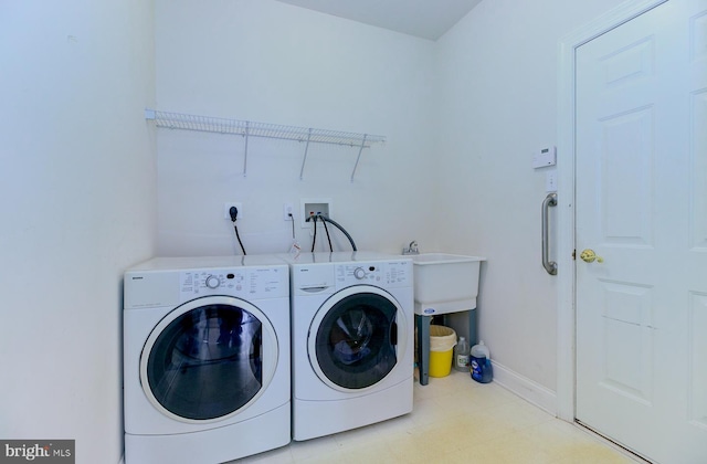 clothes washing area featuring independent washer and dryer