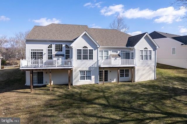 back of house with a yard and a deck