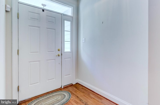 foyer entrance with light hardwood / wood-style floors