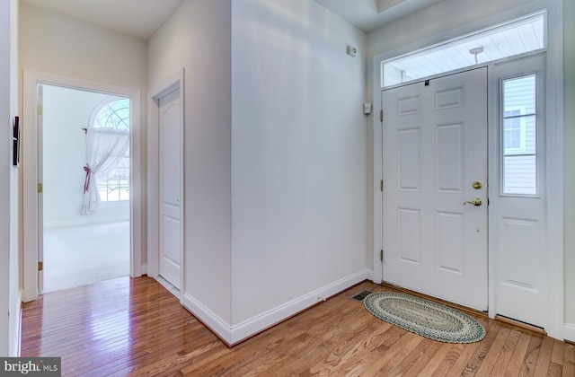 foyer with light wood-type flooring