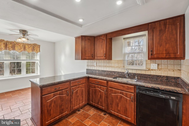 kitchen featuring sink, backsplash, black dishwasher, kitchen peninsula, and a raised ceiling