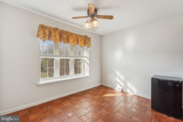 spare room featuring ceiling fan