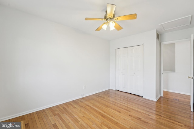 unfurnished bedroom with light hardwood / wood-style floors, a closet, and ceiling fan