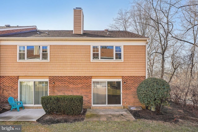 back of house with a patio