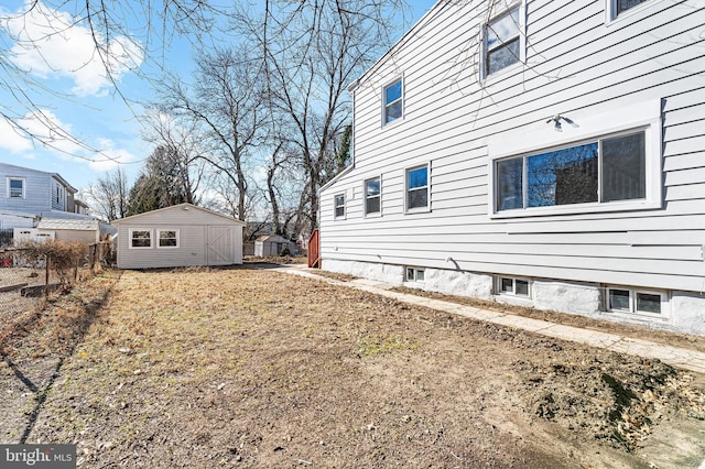 view of home's exterior featuring a storage shed