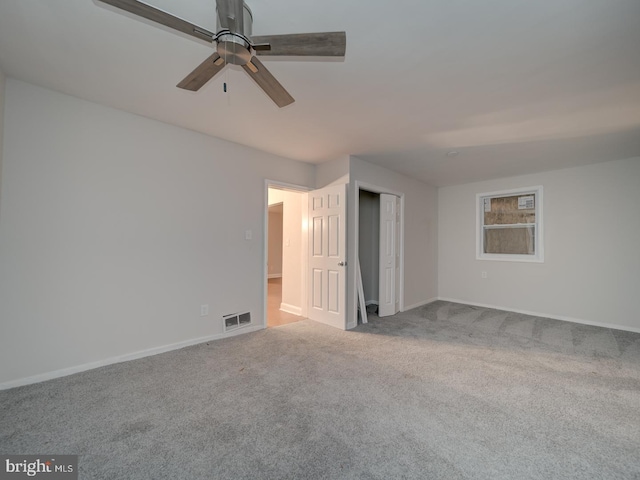 interior space with ceiling fan