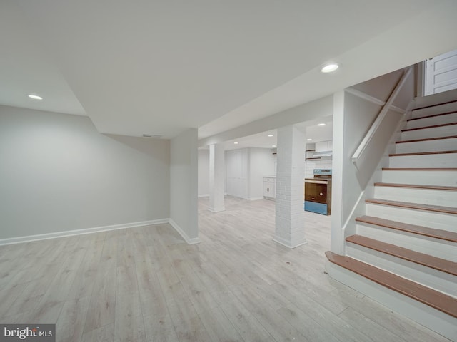 basement featuring light hardwood / wood-style flooring