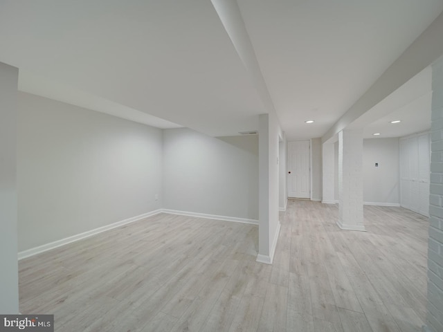 basement featuring light hardwood / wood-style flooring