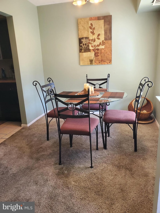 view of carpeted dining space