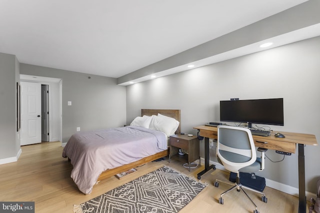 bedroom with hardwood / wood-style floors